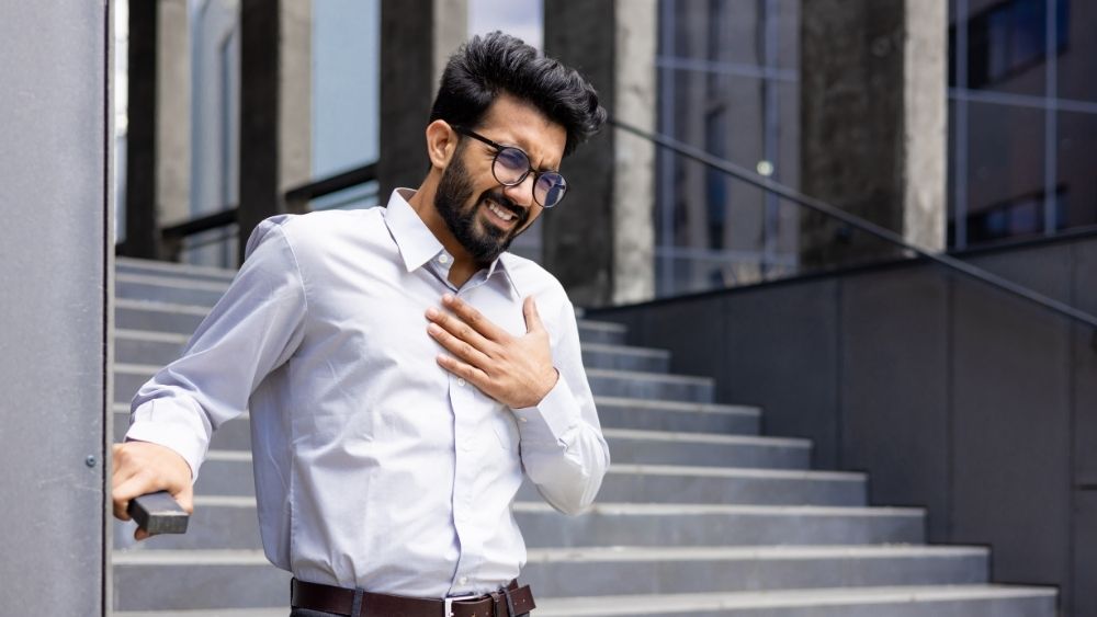Person becoming breathless while climbing stairs or walking